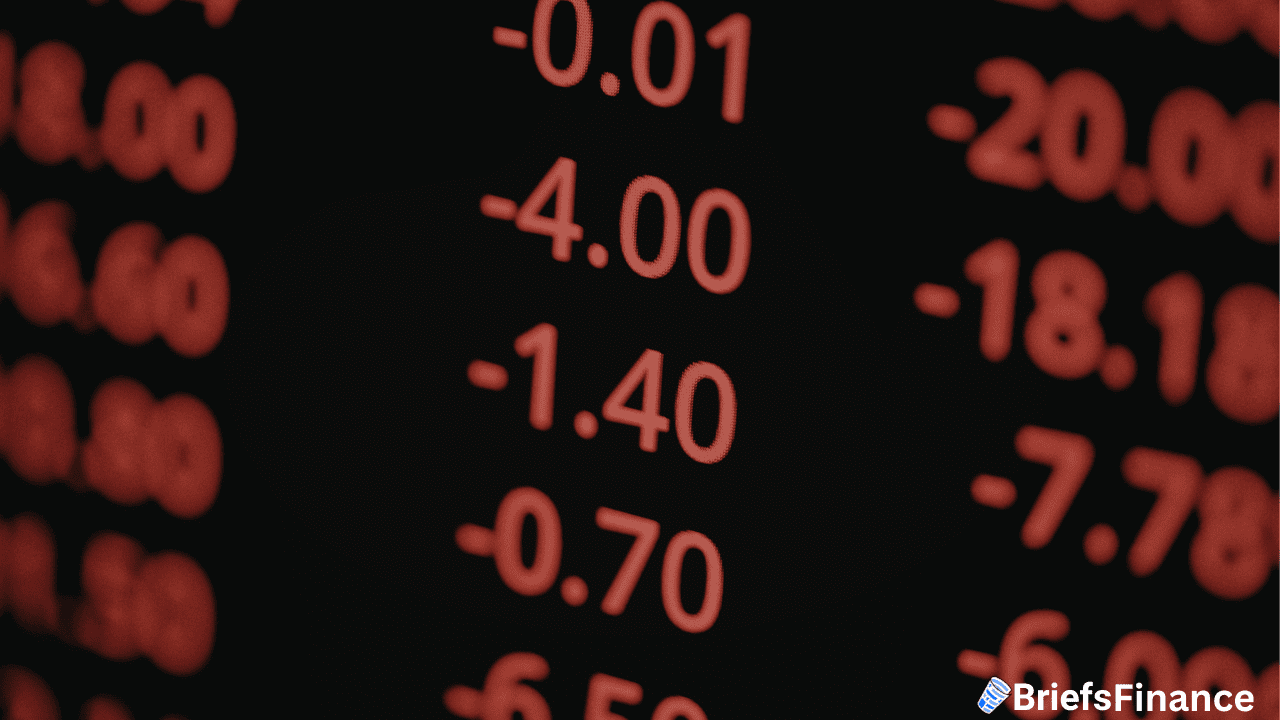 Red negative numbers on a black screen indicate falling stock prices; "BriefsFinance" logo is visible in the lower right corner.